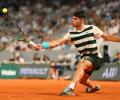 PIX: Alcaraz stumbles into French Open fourth round