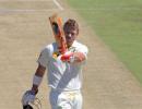 Warner century puts Australia on top