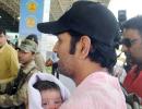 PHOTOS: Dhoni checks in for IPL with daughter Ziva in tow