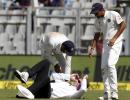 Umpire Reiffel leaves the field after being hit by ball