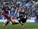 Espanyol put brakes on Barca, Atletico go top