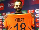 Captain Kohli gives thumbs-up to new orange jersey