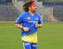 Dhoni Unveils Retro Look: Back to Long Hair, Bandanas