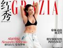 Alessandra shows serious abs on mag cover