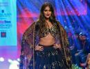 Smokin' hot! Ileana flashes toned abs in black