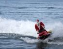 Santa Arrives On A Jet Ski!