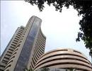 Sensex ends near day's high