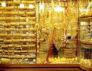 Gold price inches up, silver falls