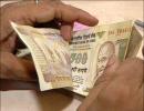 Rupee gains 20 paise to end at 55.11 vs USD