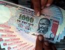 Rupee ends 3 paise lower at 63.58 against dollar