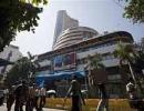 Choppy markets end firm, RBI keeps rates steady