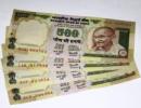 Rupee weakens by 48 paise to close at 54.97