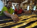 Gold tumbles by Rs 360, silver by Rs 550