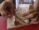 Rupee down 27 paise against dollar in morning trade