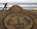 Falling rupee can help resolve India's economic woes