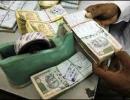 Rupee up by 24 paise vs dollar in late morning trade