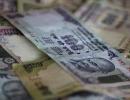 Rupee hits all-time low, ends below 60 versus dollar