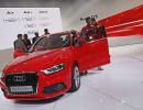 Luxury carmakers change lanes to cruise in a slow market