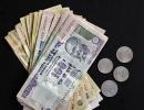 Rupee gives up early gains, ends four paise down at 61.27