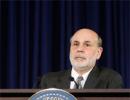 In Bernanke's final act, Fed cuts stimulus despite market turmoil