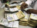 Rupee strengthens 18 paise to 61.76 vs dollar