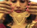 Gold ends steady in thin trade; silver down on global cues