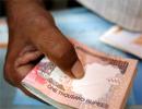 Rupee falls on year-end FII sell-off