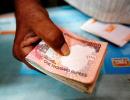 Rupee ends up 2 paise against dollar at 61.69