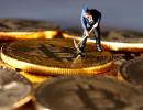 Despite odds, hunger for Bitcoins persists