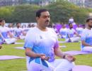 In pix: Adani, Sitharaman strike a yoga pose