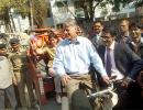 Image: American envoy rides a cycle rickshaw