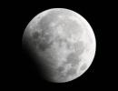 Partial lunar eclipse in the night sky