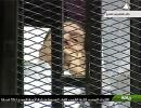 In a cage, Mubarak faces trial for murder