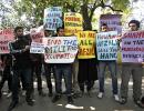 In PHOTOS: Angry protestors slam decision to hang Guru