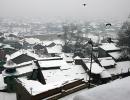 IN PICS: Heavy snowfall shuts down Kashmir