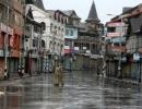 Curfew in various J-K districts; army stages flag march