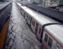 Photos: Heavy rains hit train services, make Mumbai crawl