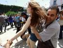 DRAMATIC pix: Topless protests, France's 1st gay marriage...