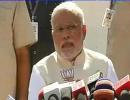 Modi in trouble with EC for flashing BJP symbol during presser