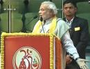 Modi shares stage with Ramdev; promises relook at taxation system