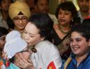 Sealed with a kiss: China's First Lady has all in smiles at Delhi school