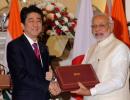 Modi, Japan's Shinzo Abe put bullet train on track, sign defence agreements