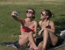 Europeans sweat and soak in sizzling summer