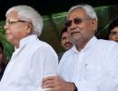 How does Nitish escape Lalu's boa constrictor-like embrace?