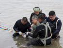 Over 400 missing hours after Chinese ship sinks, captain held