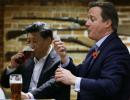 Drinks are on me! Xi, Cameron enjoy pub night out