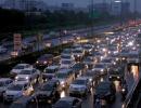 PHOTOS: Water-logged Delhi battles with slow traffic