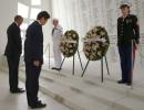 Wreaths and hugs: Japan's Abe offers sombre tribute at Pearl Harbor