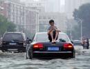 'Floods submerged my bed': 250 killed or missing in China rains