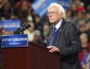 Sanders vows to help Clinton beat Trump; keeps campaign alive